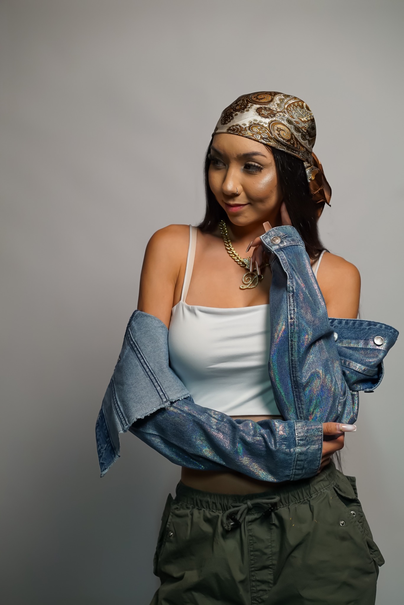 Studio fashion portrait with sunglasses and gold jewelry
