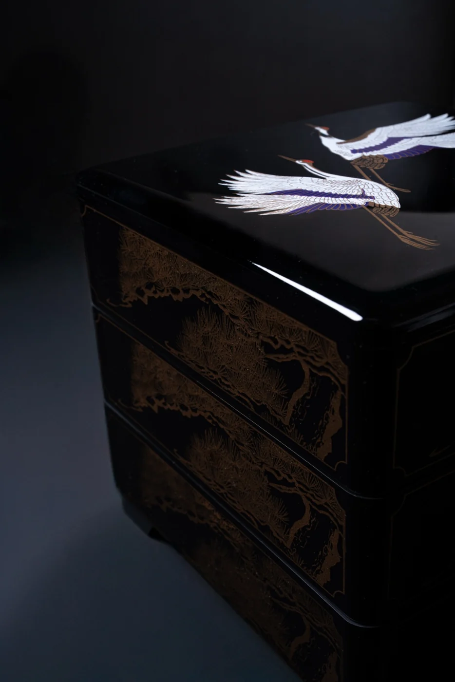 Japanese crane detail on dark wood furnishings